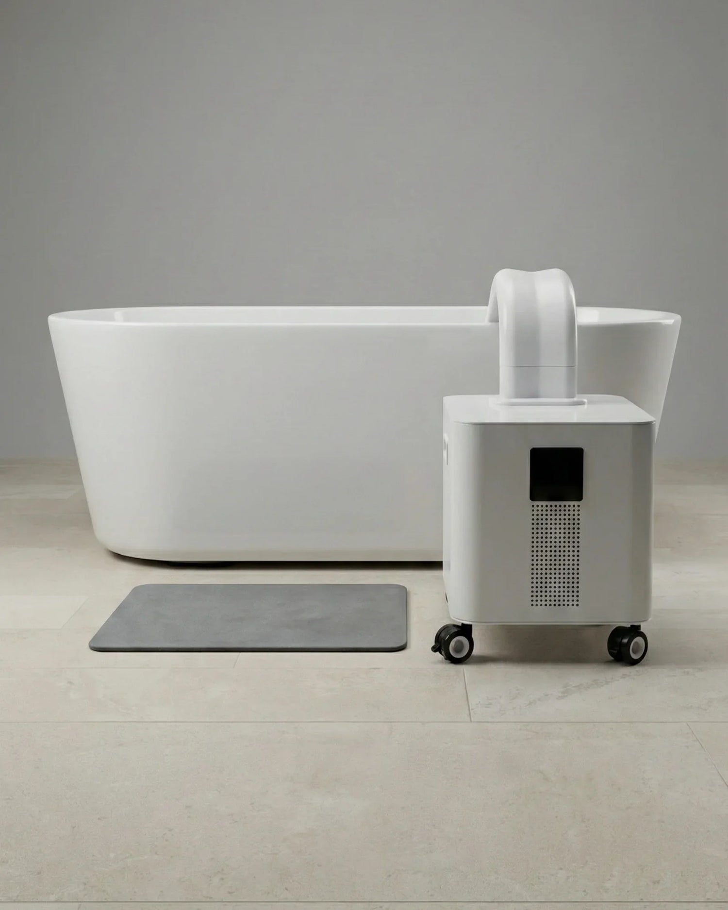 HomePlunge Bella cold plunge chiller beside a freestanding bathtub