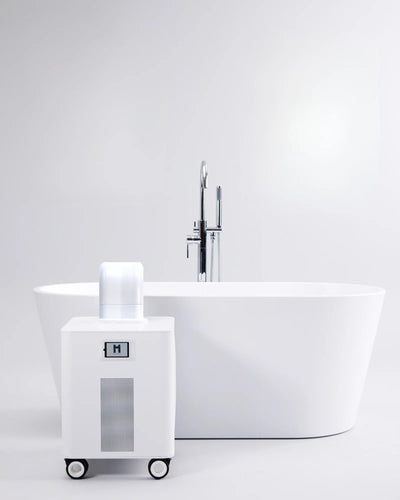 HomePlunge H3 cold plunge chiller beside a freestanding bathtub